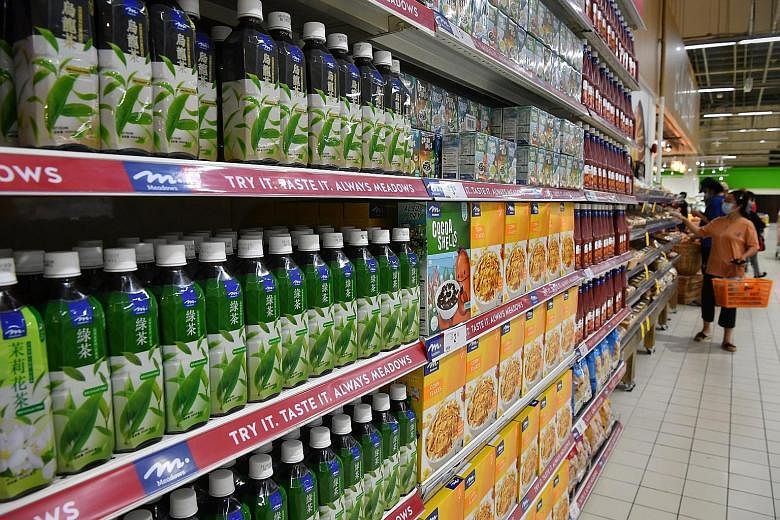 Products at the Meadows brand section of Giant hypermarket in Tampines. The brand by Dairy Farm Group was launched last month and has become the most popular brand in Giant supermarkets, the company said. Giant's price reductions will apply to produc