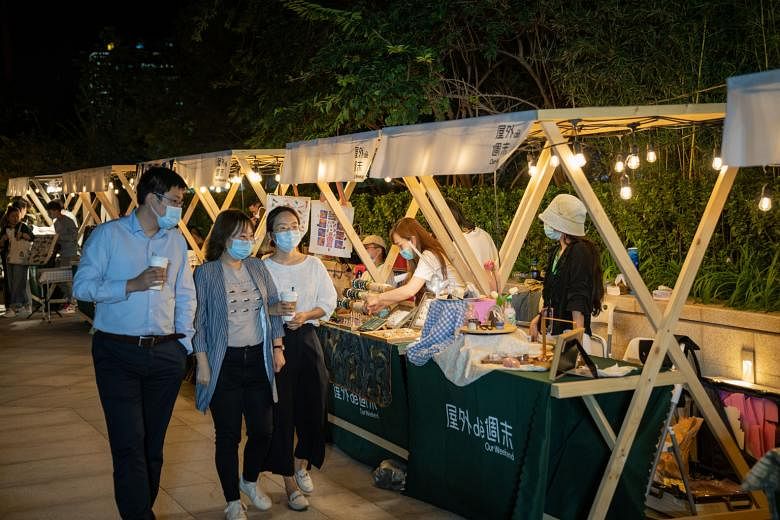 People at a night market in Beijing last Friday. Asia's economic rebound would be "strongly linked" to the recovery in the Chinese economy, says Mr Satish Shankar, the Asia-Pacific managing partner of business consultancy Bain & Company. China expand