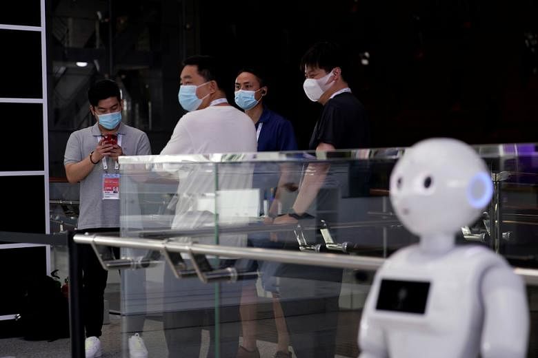 A robot at the World Artificial Intelligence Conference in Shanghai in July. The writer says it is highly unlikely that improved digital skills will be of help to the individual who is confronted with standardisation of knowledge work, labour arbitra