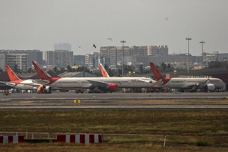 Air India says that, wherever required, only passengers with Covid-19-negative reports are allowed on board. Passengers are tested again after landing in Hong Kong, which has barred Air India for a fortnight until Oct 3, but the results "may vary fro