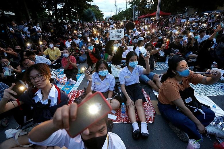 Pro-democracy protesters at a mass rally in front of Parliament in Bangkok yesterday to call for the ouster of Prime Minister Prayut Chan-o-cha and for reforms in the monarchy.