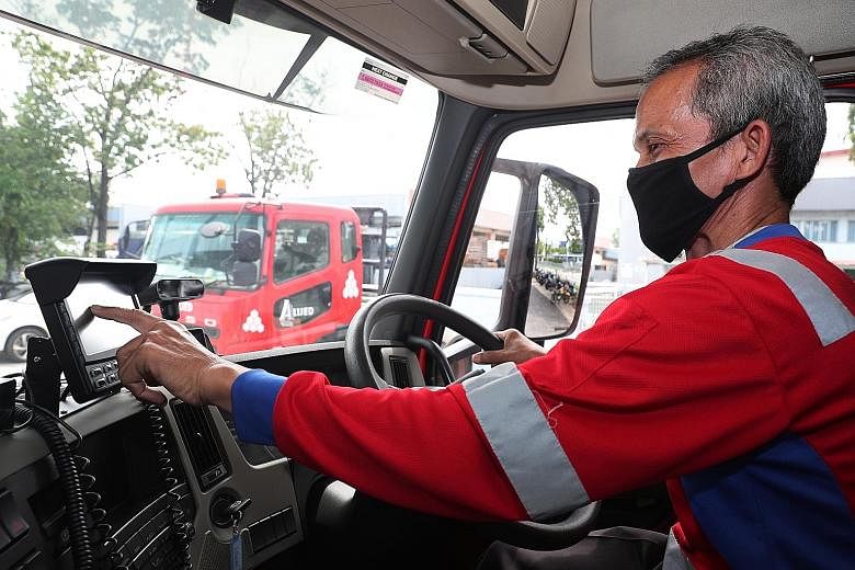 The system uses facial recognition technology to detect signs of fatigue, such as yawning, and then alerts an operations team which will check on the driver. Prime mover driver Mohamed Ali, 57, with Allied Container Services demonstrating the use of 
