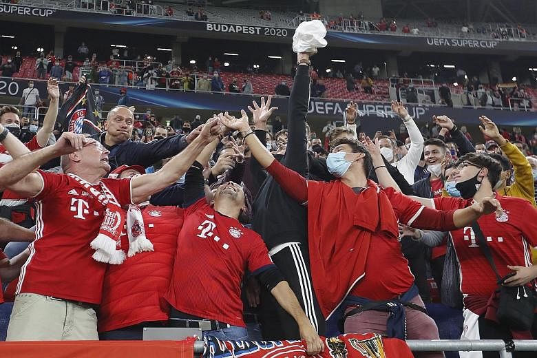Bayern Munich fans celebrating their team's victory in the Uefa Super Cup final against Sevilla at the Puskas Arena in Budapest, Hungary, on Thursday.