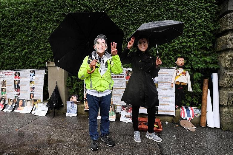 Top and above: Thai activists demonstrating on Friday in front of a villa in the German municipality of Tutzing where King Maha Vajiralongkorn often resides. They also planted a symbolic plaque in front of the villa.