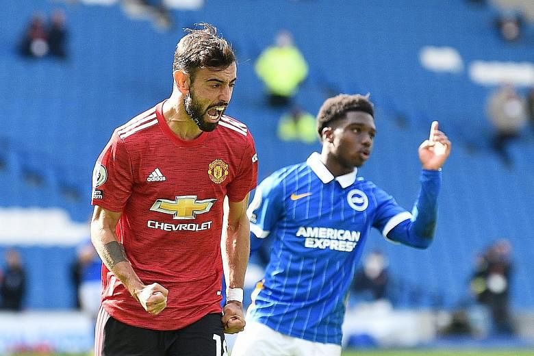 Bruno Fernandes celebrating after scoring Manchester United's third goal at Brighton yesterday. It was the 18th straight penalty that the Portuguese has converted. PHOTO: REUTERS