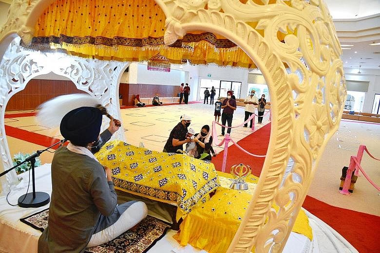The prayer hall of the Central Sikh Temple in Towner Road yesterday. The temple is among 16 religious organisations that can resume live music during worship services from Saturday in a pilot project. ST PHOTO: DESMOND WEE