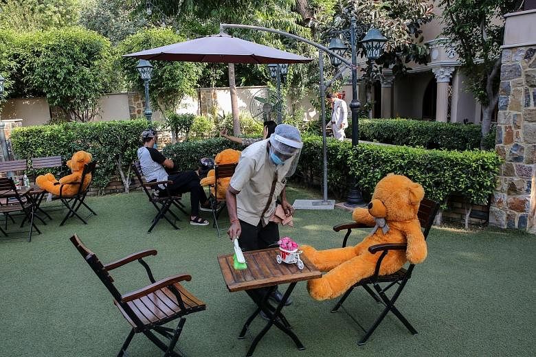 Teddy bears placed to encourage social distancing at Rustique cafe in New Delhi on Friday. The last 24 hours up to Saturday saw 85,362 new infections in India, taking the total past 5.9 million cases. PHOTO: EPA-EFE
