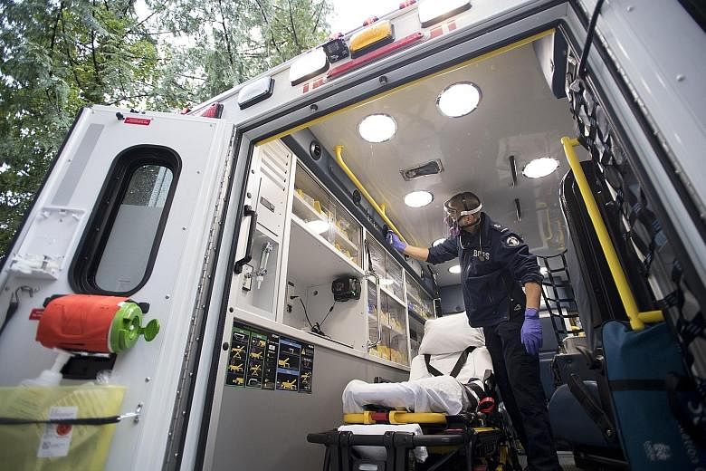 Concern over the suspected Covid-19 patient's oxygen levels led emergency doctor Mathieu Surprenant to make the call to intubate the patient, assessing that it was his best chance of survival. Paramedic Jeff Booton cleaning his ambulance in Lions Bay