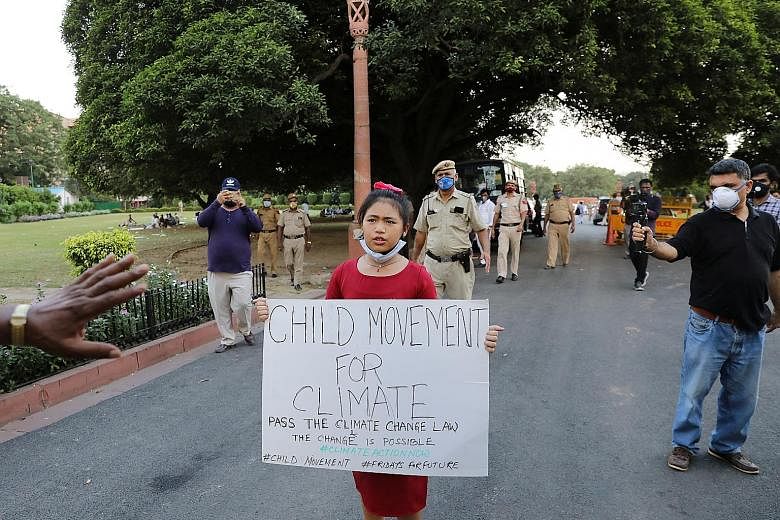 Eight-year-old Licypriya Kangujam protesting outside India's Parliament in New Delhi last Wednesday. She is leading a youth movement calling for Prime Minister Narendra Modi and Indian lawmakers to pass a law aimed at capping carbon emissions in the 