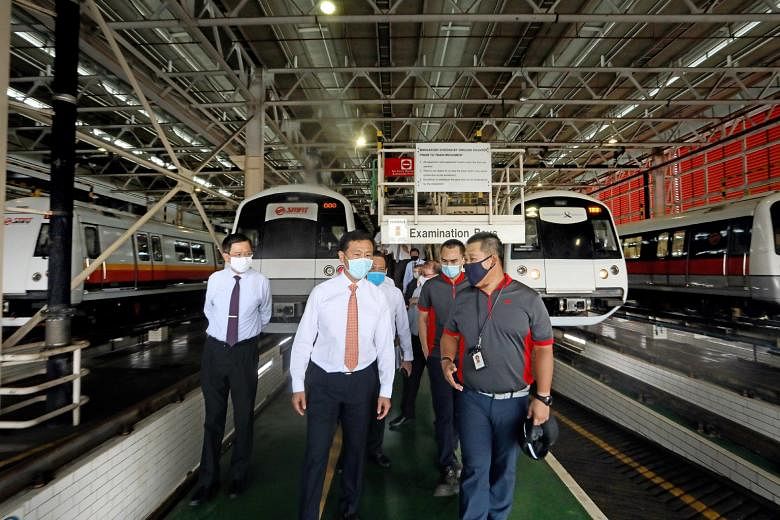 Mr Ong Ye Kung getting a virtual look at the interior of the new North-South and East-West line trains. New features include more open spaces for strollers. Minister for Transport Ong Ye Kung speaking to rail workers at the Bishan train depot yesterd