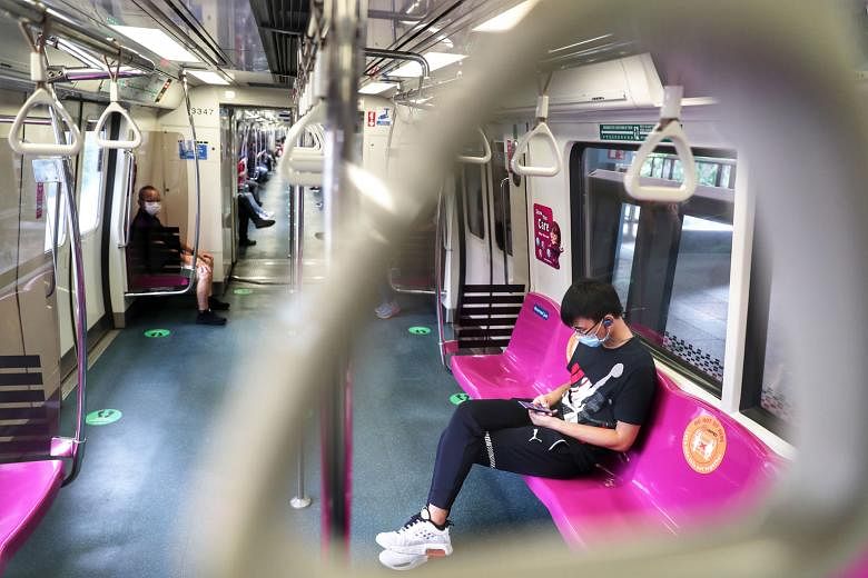 MRT riders on May 22 during the circuit breaker. While the MRT system scored 66.1 points in the commuter satisfaction poll last year, its score rose to 73.4 this year, due to less congestion and more frequent cleaning.