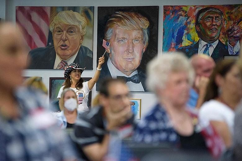 Supporters of US President Donald Trump watching the debate at the Trump Victory Campaign centre in Katy, Texas.