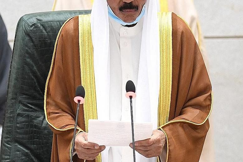 The new Emir of Kuwait, Sheikh Nawaf al-Ahmad al-Sabah, taking the oath of office in Parliament yesterday. The country has begun a 40-day period of national mourning for late ruler Sheikh Sabah al-Ahmad al-Sabah.