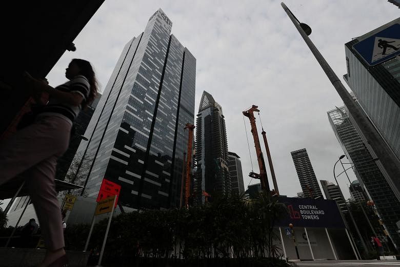 Amazon will lease three floors at Asia Square Tower 1 (left), sources say. Citigroup is currently the largest tenant there with nine floors. ST PHOTO: KELVIN CHNG