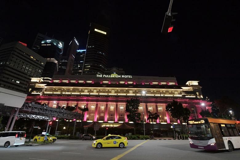 The pink light-up at The Fullerton Hotel Singapore was launched yesterday to kick off Breast Cancer Awareness Month, which falls in October. ST PHOTO: ALPHONSUS CHERN