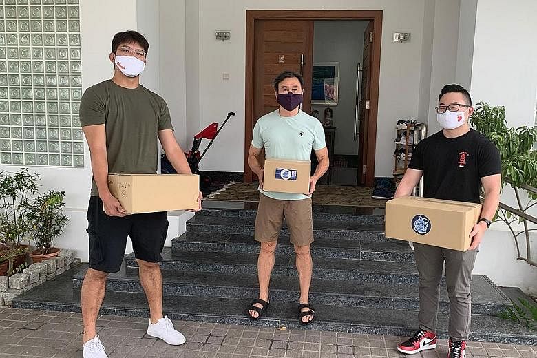 Basketballer Ng Han Bin (left) and powerlifter Matthias Yap (right) delivering meals to donors at the Chiam See Tong Sports Fund "Live For Sports" virtual fundraising dinner.