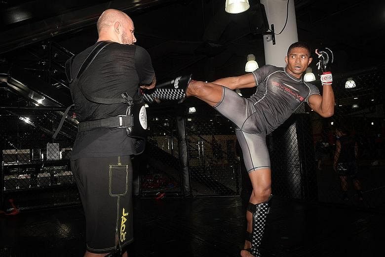 Singapore mixed martial arts fighter Amir Khan has been in training since Phase Two began in June, in preparation for his bout against permanent resident Rahul Raju next Friday.