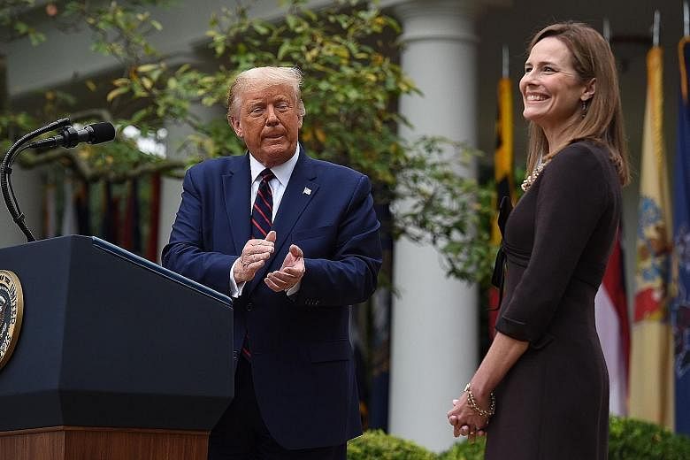 US President Donald Trump announcing his Supreme Court nominee Amy Coney Barrett at the White House last Saturday. It is unclear how many aides who had close contact with him have tested positive. PHOTOS: AGENCE FRANCE-PRESSE, EPA-EFE