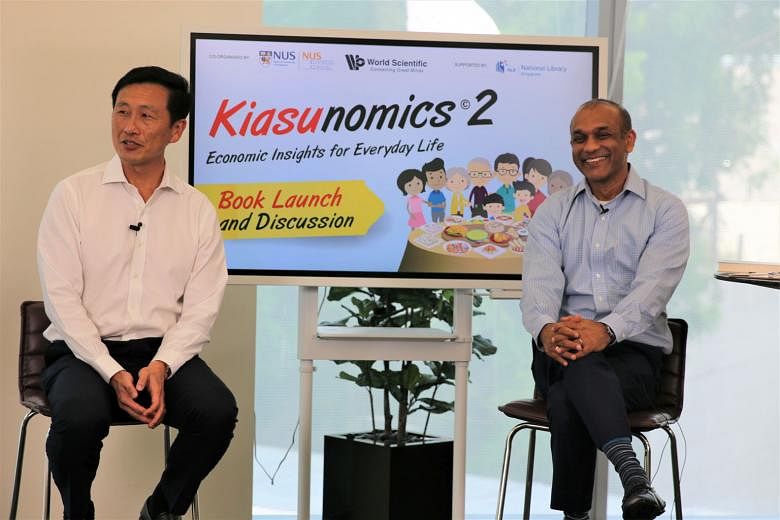 Transport Minister Ong Ye Kung and NUS Business School's Professor Sumit Agarwal at a panel discussion during the virtual launch of Kiasunomics 2: Economic Insights For Everday Life on Thursday. PHOTO: NUS BUSINESS SCHOOL