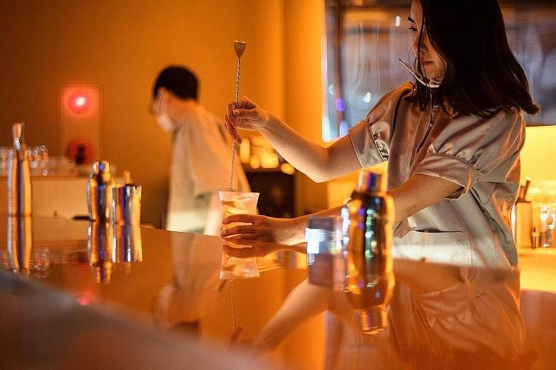 A bartender making a cocktail in a non-alcoholic bar in Tokyo. Booze-free bars are cropping up elsewhere in Japan, as Health Ministry data suggests heavy drinking is falling among young people.