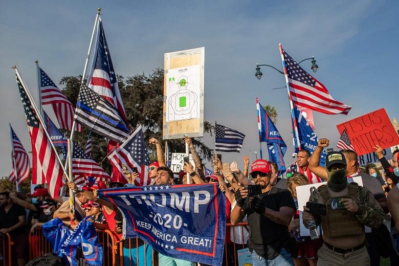 People at a pro-Trump rally in Beverly Hills, California, last Saturday. To keep supporters energised, the Trump campaign is billing its next phase as "Operation Maga" - a mix of virtual events leading up to Wednesday's scheduled debate between Vice-