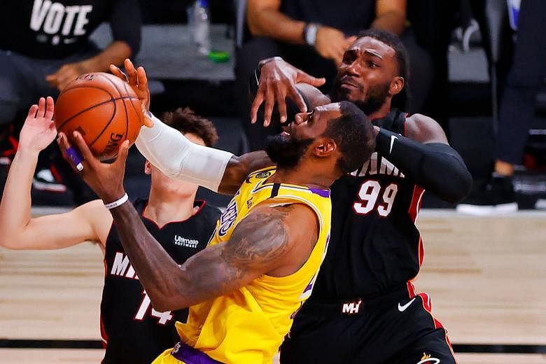 Jae Crowder (No. 99) of the Miami Heat defending LeBron James of the Los Angeles Lakers during the fourth quarter of Game 4 of the National Basketball Association Finals at Florida's ESPN Wide World of Sports Complex on Tuesday. The Lakers hold a 3-1