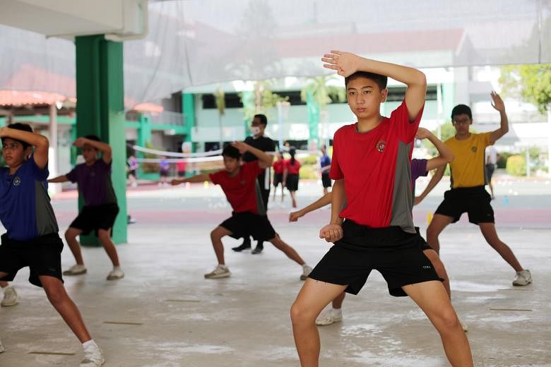 Secondary 2 students from Chua Chu Kang Secondary School during a wushu session in August. The 1m distance between students will still apply when more school and co-curricular activities resume. When they practise sports while unmasked, they should s