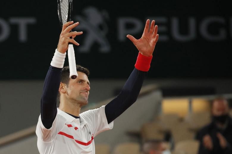 Djokovic celebrates after winning his quarter-final match against Spain's Pablo Carreno Busta.