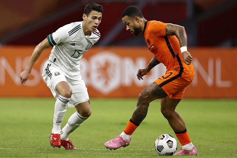 Netherlands forward Memphis Depay taking on Mexico defender Hector Moreno on Wednesday. The 1-0 friendly defeat at home will be a concern for new coach Frank de Boer as many fans and critics are not convinced he is the right man for the job ahead of 