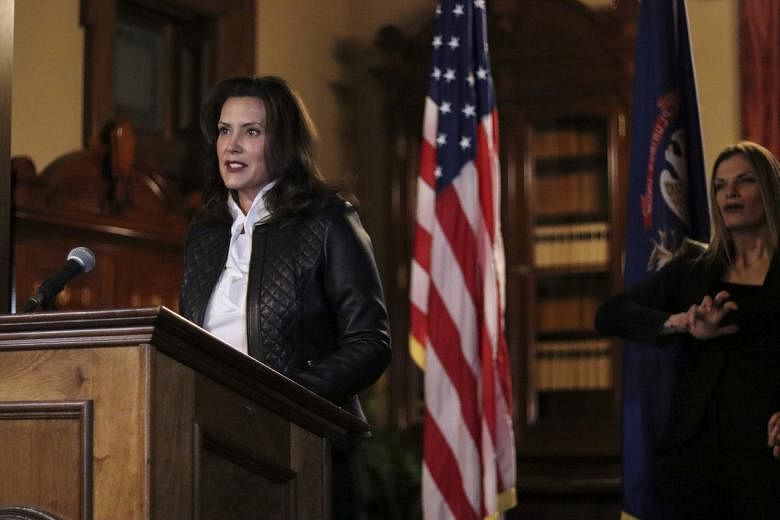 Michigan Governor Gretchen Whitmer speaking on Thursday at a news conference in Lansing, Michigan after 13 men, including seven associated with the Wolverine Watchmen militia group, were arrested for two related plots to take her hostage and to "inst