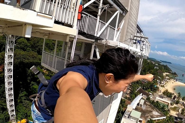 The writer finally letting go of her fear and leaping off from the bungee jump tower.