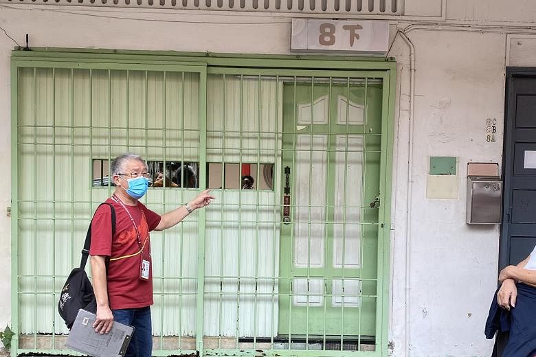  Tourist guide Chris Ng pointing out an active brothel (above) in Keong Saik Road. The tour also stops at 17A Keong Saik Road, the subject of the 2017 memoir of the same name by Charmaine Leung, about her mother who grew up in a brothel in the 1970s.