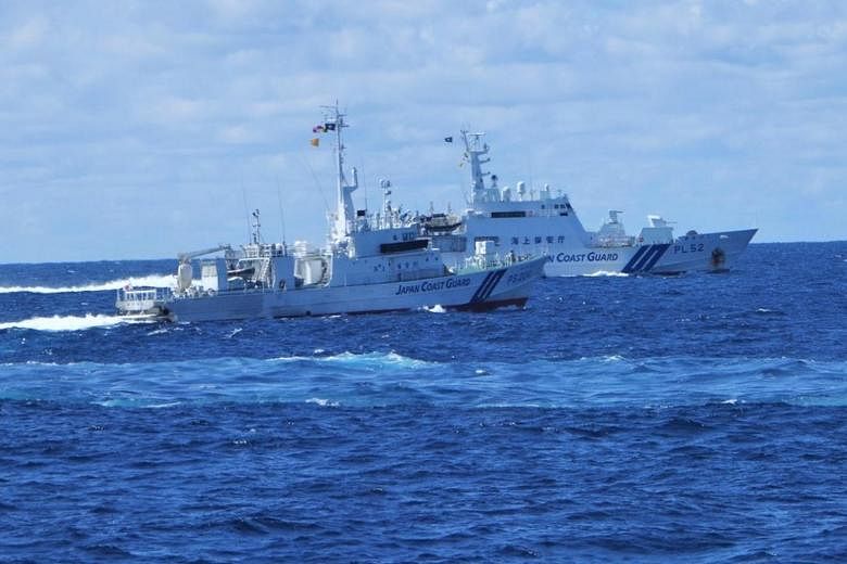 Japan coast guard says Chinese vessels sail near disputed East China ...