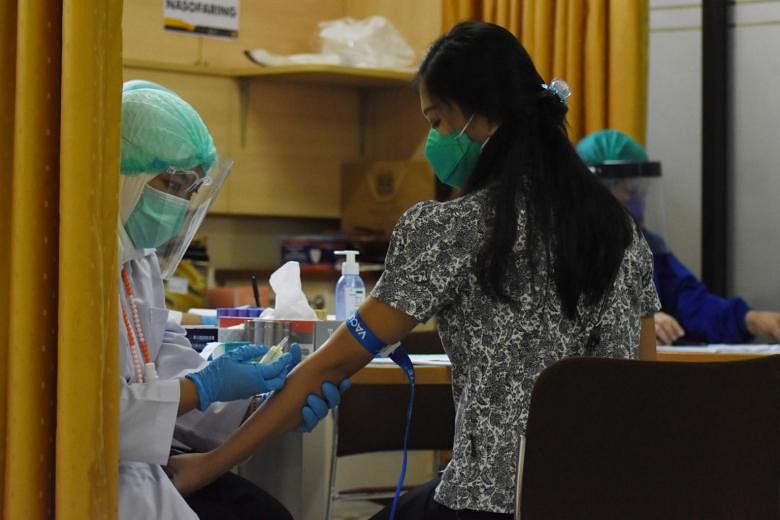 Indonesia started training health officials at community clinics to administer Covid-19 vaccines from late September.