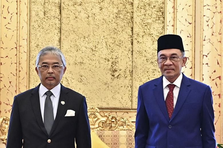 Malaysia's king, Sultan Abdullah Sultan Ahmad Shah (left), and opposition leader Anwar Ibrahim inside the Royal Palace in Kuala Lumpur on Oct 13, 2020.