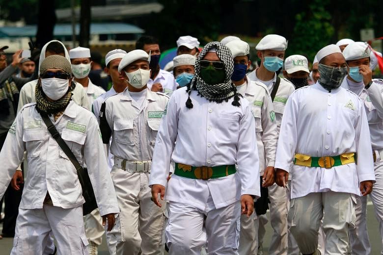 Above: Members of Islamic groups also joined the protests in the Indonesian capital against the omnibus law.