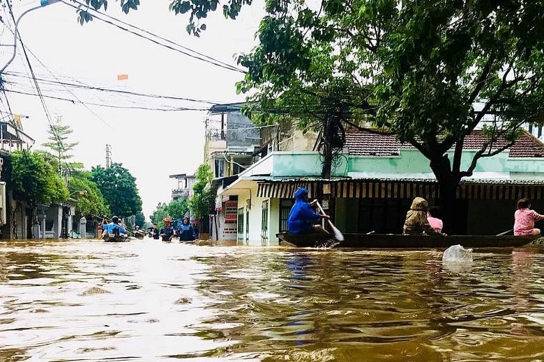 A flooded street in Hue, Vietnam, on Sunday. The floods are expected to worsen over the coming days, with tropical storm Nangka forecast to dump more rain as it makes landfall in Vietnam today. 