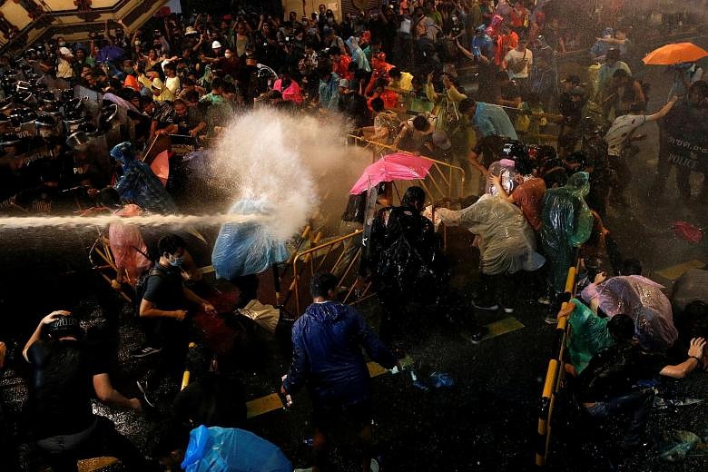 Thai Police Shoot Stinging Water At Defiant Protesters | The Straits Times