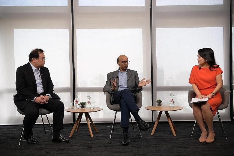 Senior Minister Tharman Shanmugaratnam at a fireside chat yesterday with OCBC Bank group chief executive Samuel Tsien (left) and moderator Yvonne Chan, where they discussed job matching and reskilling workers.