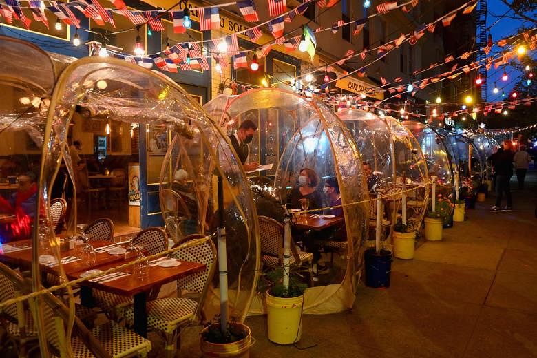People dining in plastic tents as restaurant operators in New York City whip out every possible safety measure to stay afloat during the pandemic. The number of cases in New York state have been going up over the past couple of weeks.