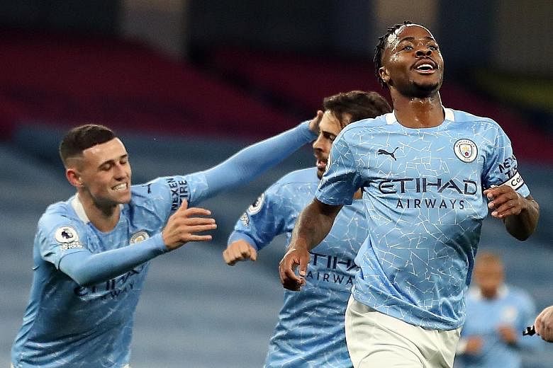 Manchester City forward Raheem Sterling celebrating his second goal in four Premier League matches with the winner against Arsenal on Saturday. Pep Guardiola's men have played one game fewer than most of their rivals as they were allowed to start the