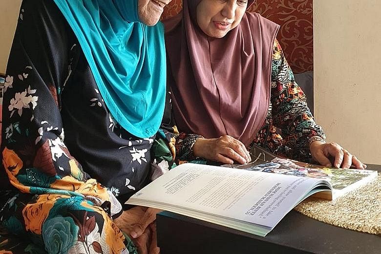 Madam Fatimah Mohamed Jamaludin (left), who has dementia, with her sister and caregiver, Madam Hasnah Mohamed Maideen. PHOTO: COURTESY OF HASNAH MOHAMED MAIDEEN