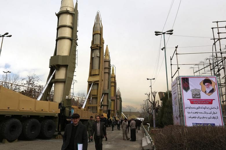 A file photo from February last year showing Iranians visiting a weaponry and military equipment exhibition in Teheran. Iran yesterday hailed the expiry of the UN arms embargo as a diplomatic victory over its arch enemy, the US.