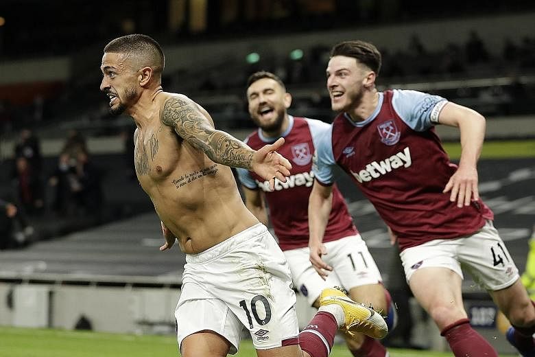 Manuel Lanzini leading the wild celebration after his long-range effort capped a late three-goal spurt in the 3-3 Premier League draw with Tottenham on Sunday. PHOTO: EPA-EFE