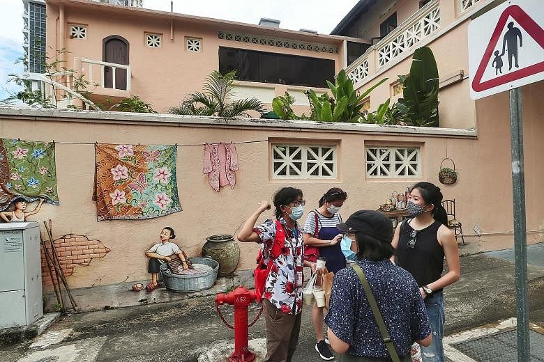 Tours will still be subject to prevailing social gathering sizes, which means that 20 people must be split into four groups, with no intermingling allowed, the STB said. ST PHOTOS: KELVIN CHNG, ONG WEE JIN