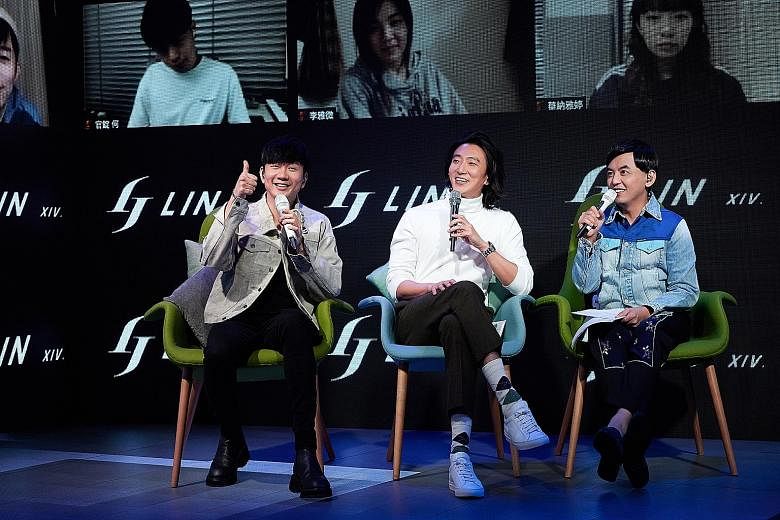 Singaporean singer JJ Lin (far left) with Taiwan-born singer Harry Chang (centre) and Taiwanese host Mickey Huang (left) in Taipei at the global listening party.