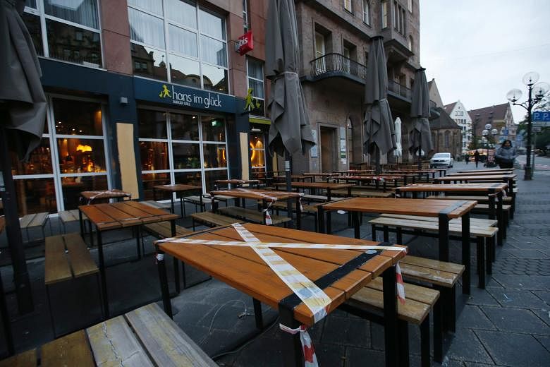An empty restaurant terrace in Nuremberg, Germany, on Monday. The number of new Covid-19 cases in the country rose by 8,397 yesterday, the highest since the pandemic began. PHOTO: BLOOMBERG