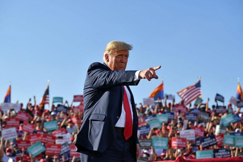 US President Donald Trump at a rally in Arizona on Monday. He has repeatedly said the nation is "rounding the corner" on the pandemic, a message at odds with top infectious disease expert Anthony Fauci.