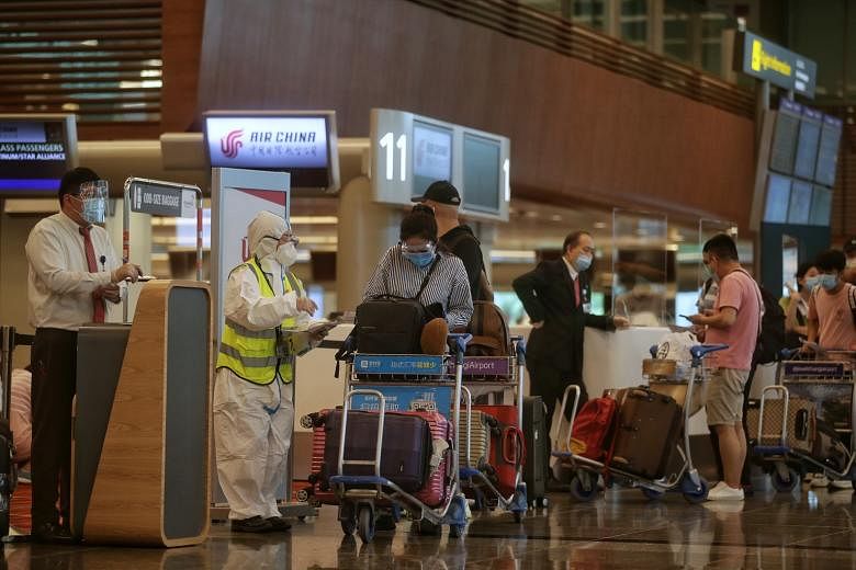 Passengers at the departure hall of Changi Airport Terminal 1 last month. In line with the move to progressively reopen Singapore's borders, the Ministry of Health said yesterday that Singaporeans, permanent residents and long-term pass holders who t