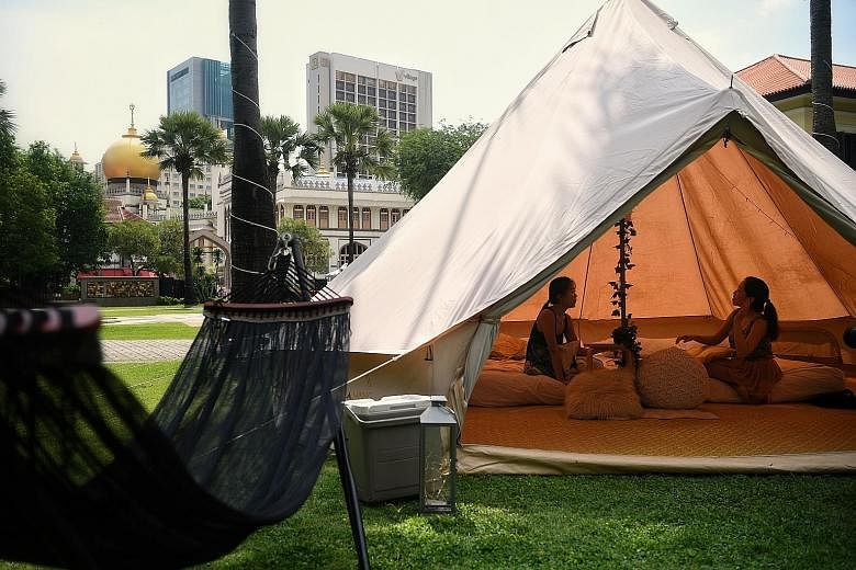 One of the two tents for the two-day, one-night "glamping" experience at the Malay Heritage Centre - between Dec 15 and 24 - is equipped with two queen-sized beds and a hammock, while another tent provides a space to watch movies with a projector scr
